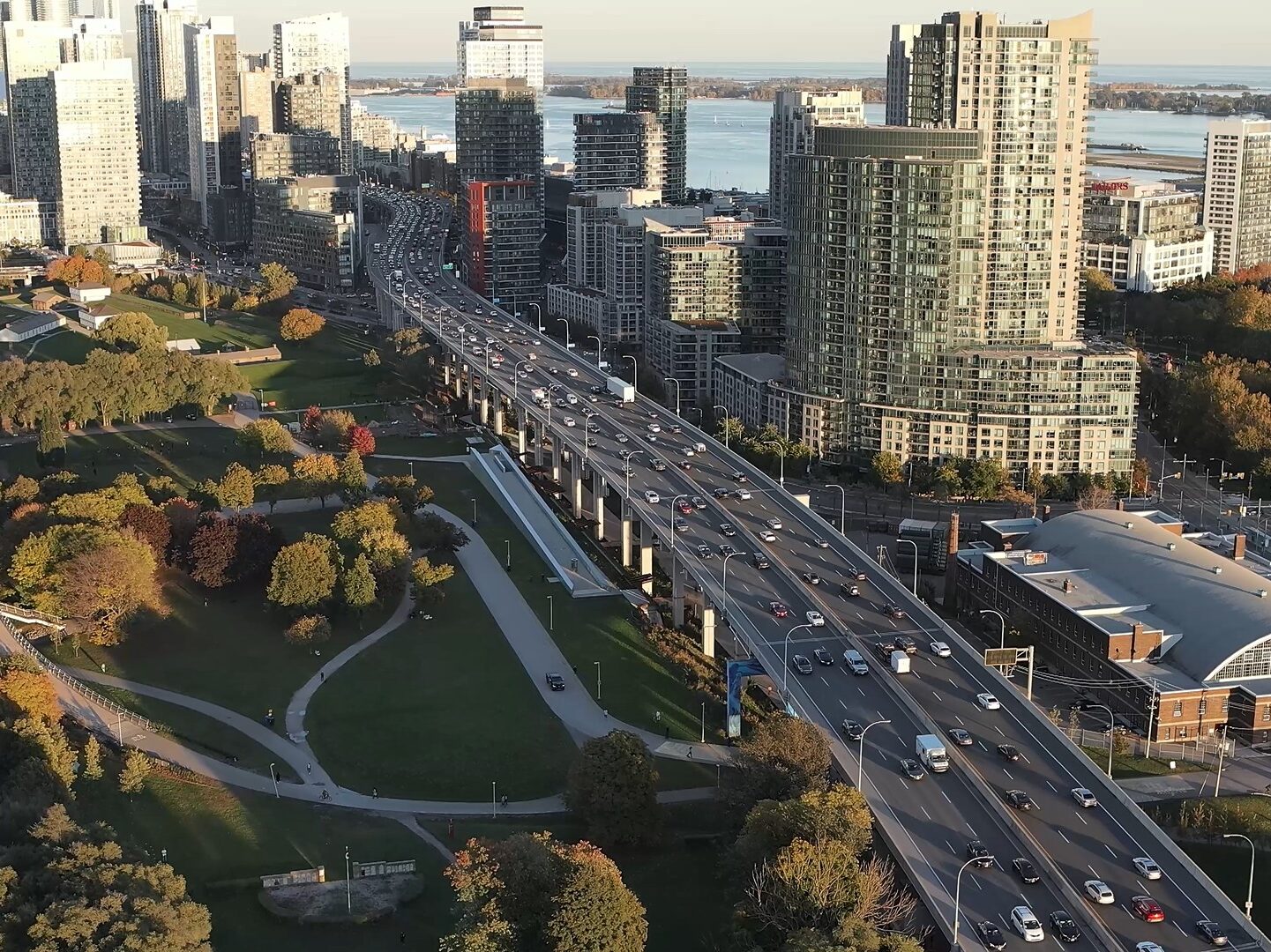 Drone shot of the Gardiner Expressway and surrounding high rises and green spaces