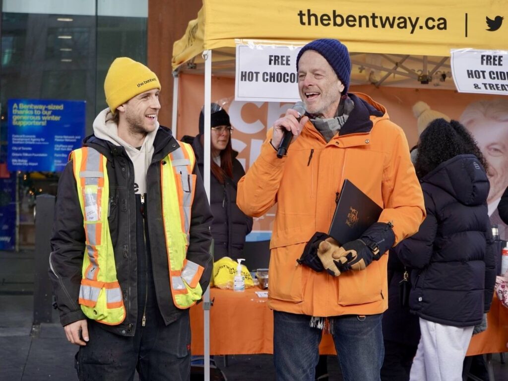 MPP Chris Glover and The Bentway's Production Manager, Michael Clarke, making a speech at The Bentway's Skate With Chris event. 