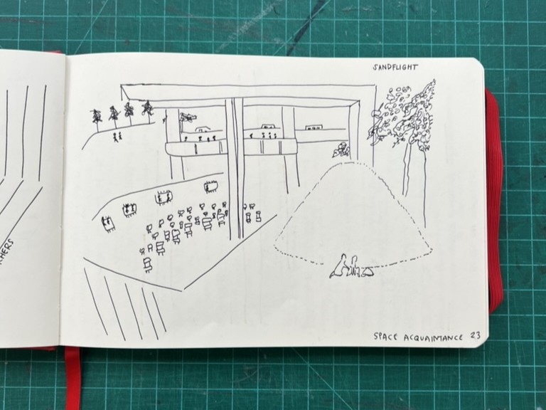 A notebook with a sketch depicting Sand Flight at The Bentway. 